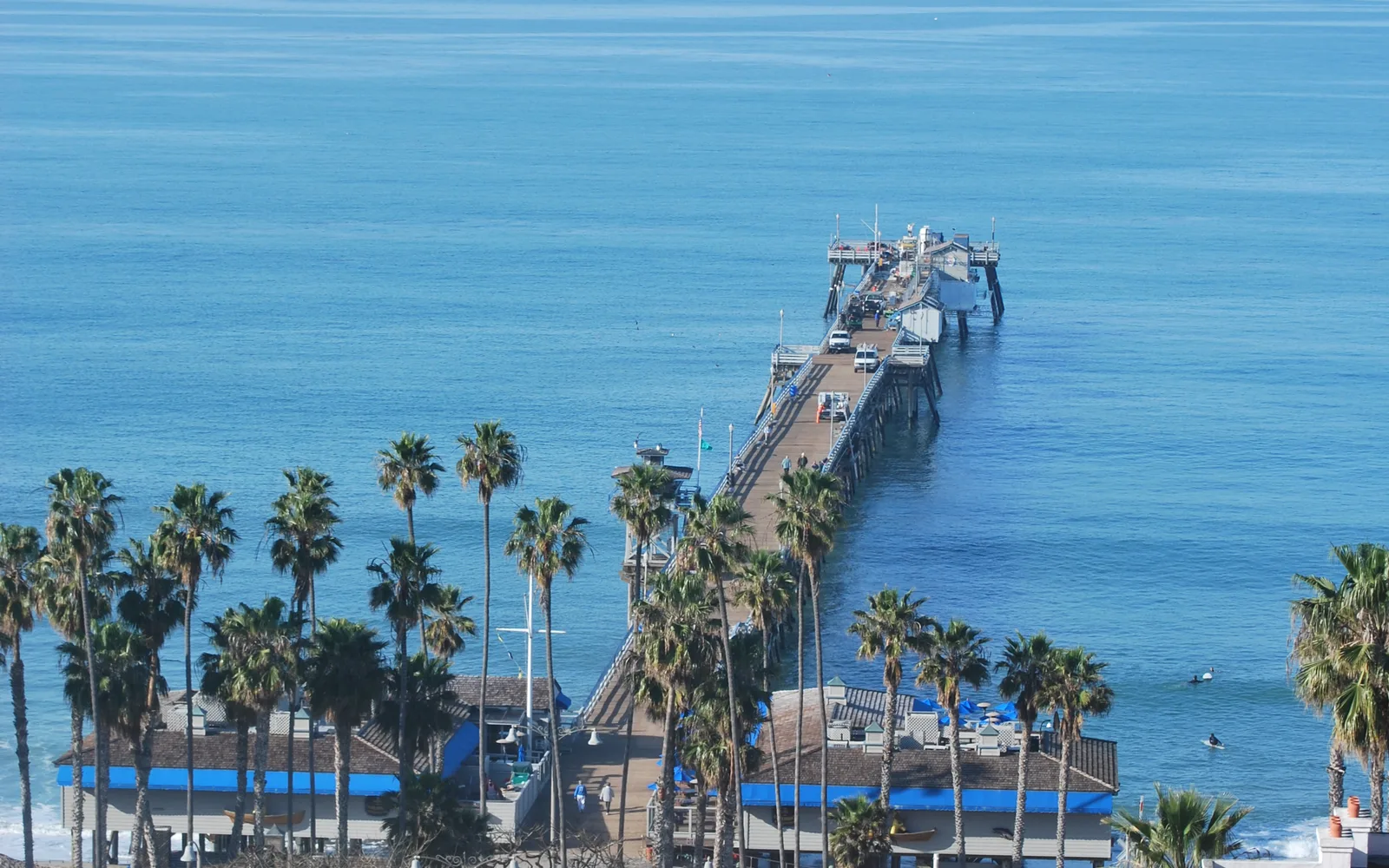 The San Clemente Pier extending into the Pacific Ocean on a clear day